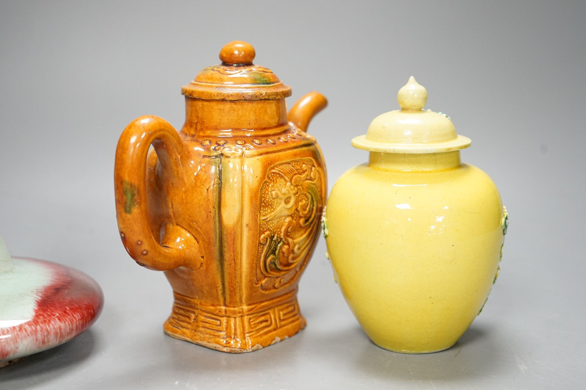 A Chinese enamelled yellow-ground jar and cover, a pottery teapot and cover and a flambe vase, latter 13cm